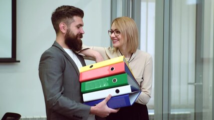 Work romance with secretary or employee. Sexy female office worker flirting in workplace with boss. Young seduces female employee. Abuse of work status.