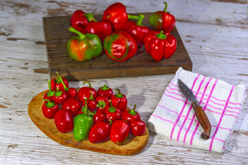 High angle shot of red peppers on wooden cutting boards