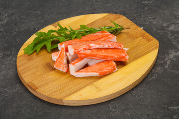 Crab stick surimi over board