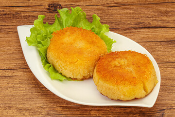 Vegan cuisine - Potato cutlet in the plate
