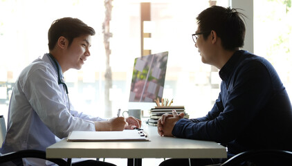 
A professional physician is consulting concerned patient at  hospital.