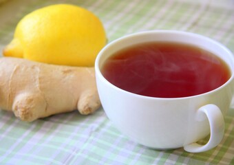 Black hot tea with fresh and natural lemon and ginger root is good for treating colds and viral diseases.