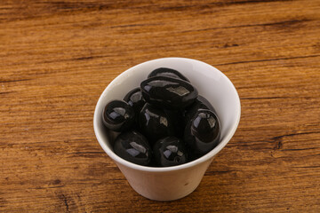 Pickled black olives in the bowl