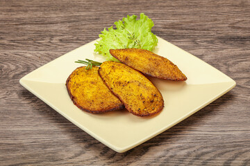 Baked potato with herbs and spices