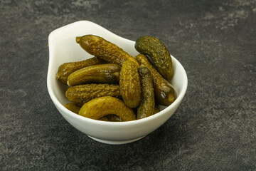 Pickled gherkin in the bowl