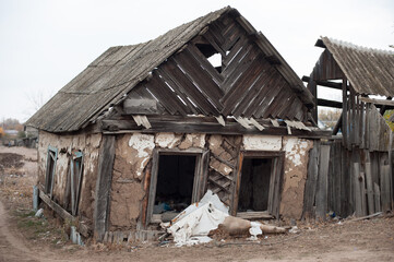 Old crumbling wooden house in the village