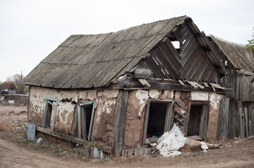 Old crumbling wooden house in the village