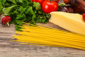 Raw Italian spaghetti heap with cheese
