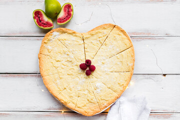 Homemade cookie with raspberry, fig and towel on the white wood desk