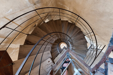 Fototapeta na wymiar The spiral wooden stairs down