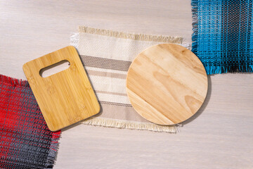 empty wooden cutting boards on a light background with space for copying text. flat lay