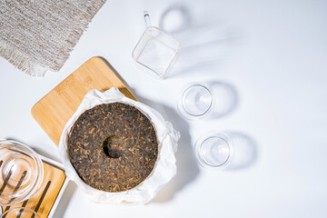 Chinese puer fermented and pressed tea. Healthy nutrition and antioxidant drinks. space for text. flat lay