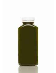 Cold-pressed spinach juice for detoxification against a white background. Juice made of organic fruits and vegetables.