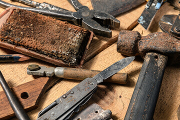 Old vintage household hand tools still life on a wooden background in a DIY and repair concept