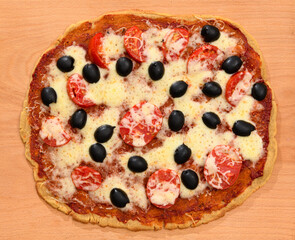 homemade pizza, vegetarian food, baked vegetables and cheese, tomatoes and olives, delicious food on a wooden background