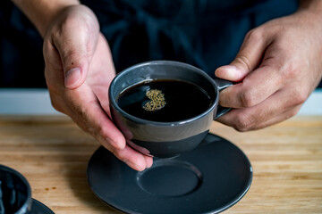 Man making coffee in the kitchen.
Delicious coffee image.