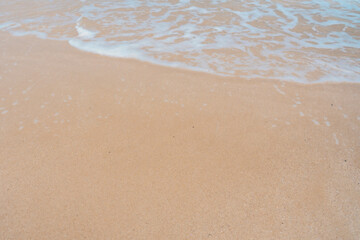 Fototapeta na wymiar Beautiful quiet white sand beach and sea wave in Tropical ocean summer time.