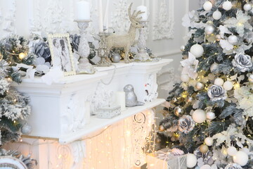 Celebratory New Year tree decorated with beautiful fur-tree toys and Christmas gifts in gift packages and celebratory boxes