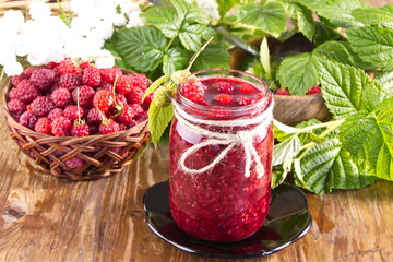 Homemade raspberry jam made from fresh wild berries preparation for winter sweet treat