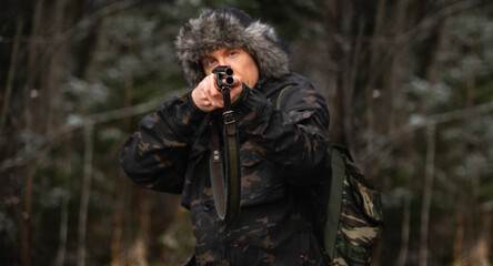 Hunter aiming a shotgun