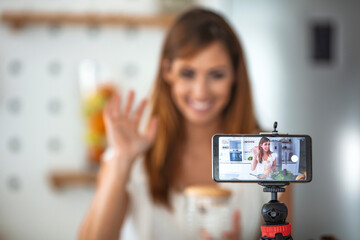 Food blogging, social media hobby broadcasting, or online learning course concept. Culinary Vlog. Baking Blog. Caucasian Woman Cooking and Show Baking for Social Media.