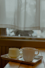 Hot coffee and tea on wooden table in cafe. Place for text. Banner Concept.