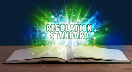 REGULATION STANDARD inscription coming out from an open book, educational concept