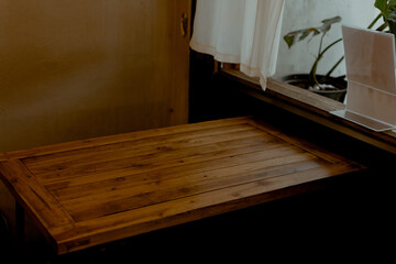 Wooden table in coffee shop. Interior design of a wooden Japanese style, cafe. Home cafe.
