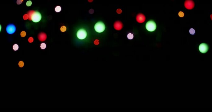 The Christmas lights of the garland sparkle brightly. 