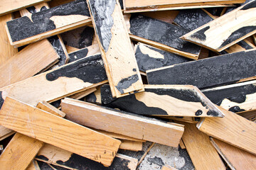 Home floor renovation. Old parquet demolition. Wooden floor panel removal. Apartment refreshing background.