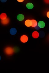 The multicolored side's or boke on a black background. Merry Christmas and happy New Year. Christmas background.