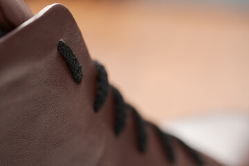 Closeup detail shot of brown leather sneaker