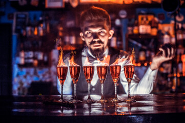 Barman mixes a cocktail on the beerhouse