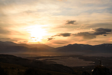 Obraz premium sun sunrise mountains steppe clouds sky