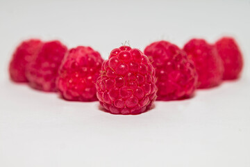 raspberries on white background