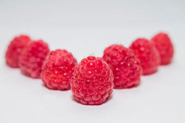 raspberries on white background