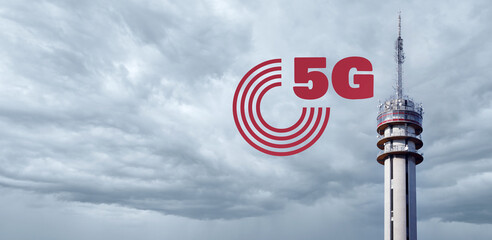 Telecommunications 5G Tower Against Dramatic Clouds. Wireless Systems And Internet Of Things Concept.