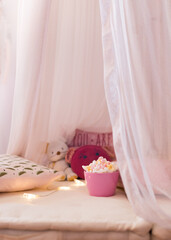 Bowl of colorful marshmallows in an intimate comfortable baby place.
