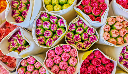 Beautiful bouquets of mixed flowers in a flower shop. A bright mix of flowers. Background on full screen. Handsome fresh bouquets. Flowers delivery. Floral shop. Selective focus.