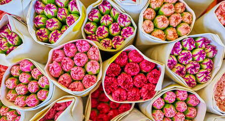 Beautiful bouquets of mixed flowers in a flower shop. A bright mix of flowers. Background on full screen. Handsome fresh bouquets. Flowers delivery. Floral shop. Selective focus.