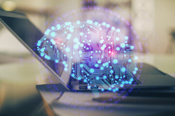 Double exposure of desktop with computer and brain drawing hologram. Artificial intelligence concept.