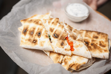pita bread roll filled with feta cheese and sauce