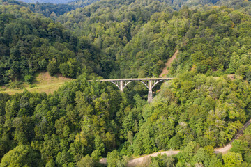Old miners' railway bridge in the mountains and forests. Tkuarchal, Akarmara, Abkhazia, Georgia