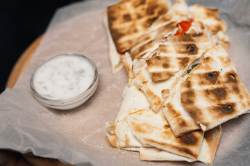 pita bread roll filled with feta cheese and sauce