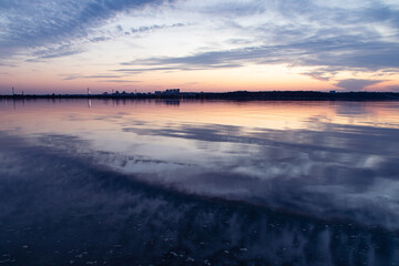Fototapeta na wymiar Sunset on the Kiev Sea with the view on town Vyshgorod, Ukraine