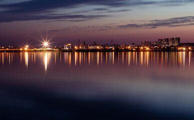 Fototapeta na wymiar Night lights of town Vyshgorod on the Kiev Sea, Ukraine