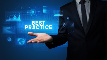 Hand of Businessman holding BEST PRACTICE inscription, business success concept