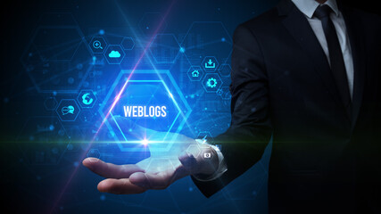 Man hand holding WEBLOGS inscription, social media concept