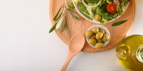 Mediterranean salad with fresh products and olive oil top view