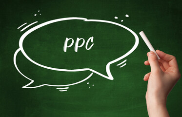 Hand drawing PPC abbreviation with white chalk on blackboard
